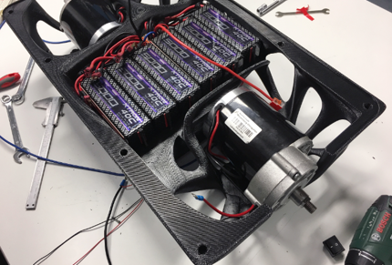 The 3D printed scooter frame houses the batteries and electric motor.
