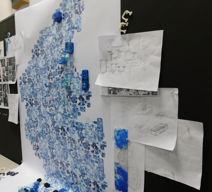 A closeup of 3d printed parts on a wall. 