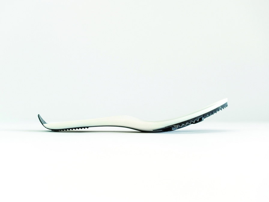 Prototype of a sole unit for a Brooks racing track spike.