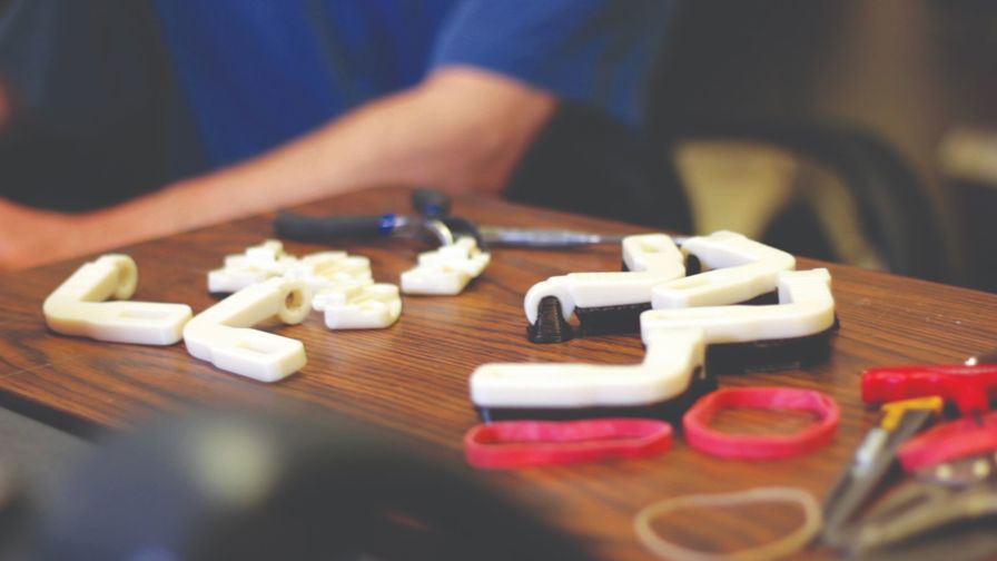 In his workshop in Nemours’ pediatric engineering
research lab, Whitney Sample has developed and 3D
printed custom WREX devices for 15 of his smallest
patients. Resistance bands relieve the force of gravity
on the arms, much like the springs on a swing-arm lamp
keep it suspended in air. In his workshop in Nemours’ pediatric engineering
research lab, Whitney Sample has developed and 3D
printed custom WREX devices for 15 of his smallest
patients. Resistance bands relieve the force of gravity
on the arms, much like the springs on a swing-arm lamp
keep it suspended in air.