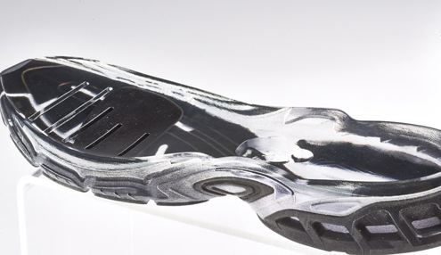 The opaque flexible material has been over-molded into the transparent rigid material. This was achieved via a single print.