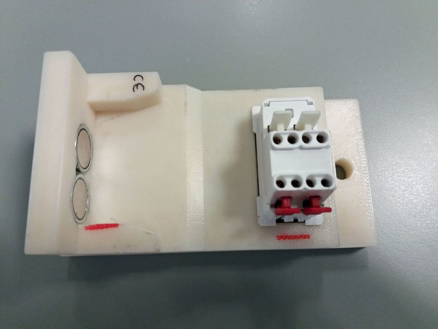 Assembly-line tool 3D printed in ABS, designed to hold switches during production process.