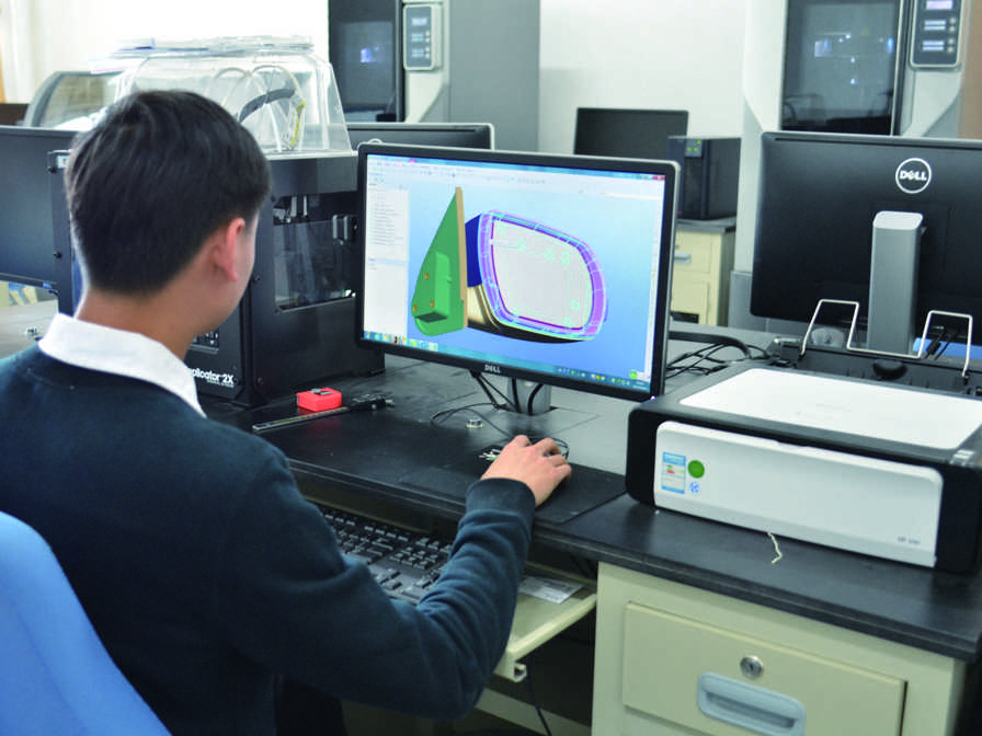 SDPI student in the mechanical models lab.