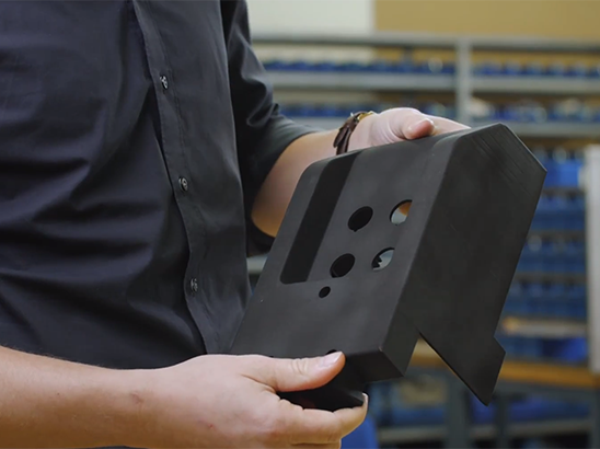 engineer holds 3d printed part engineer holds 3d printed part