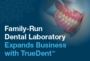 dental-technician-holding-3d-printed-dentures