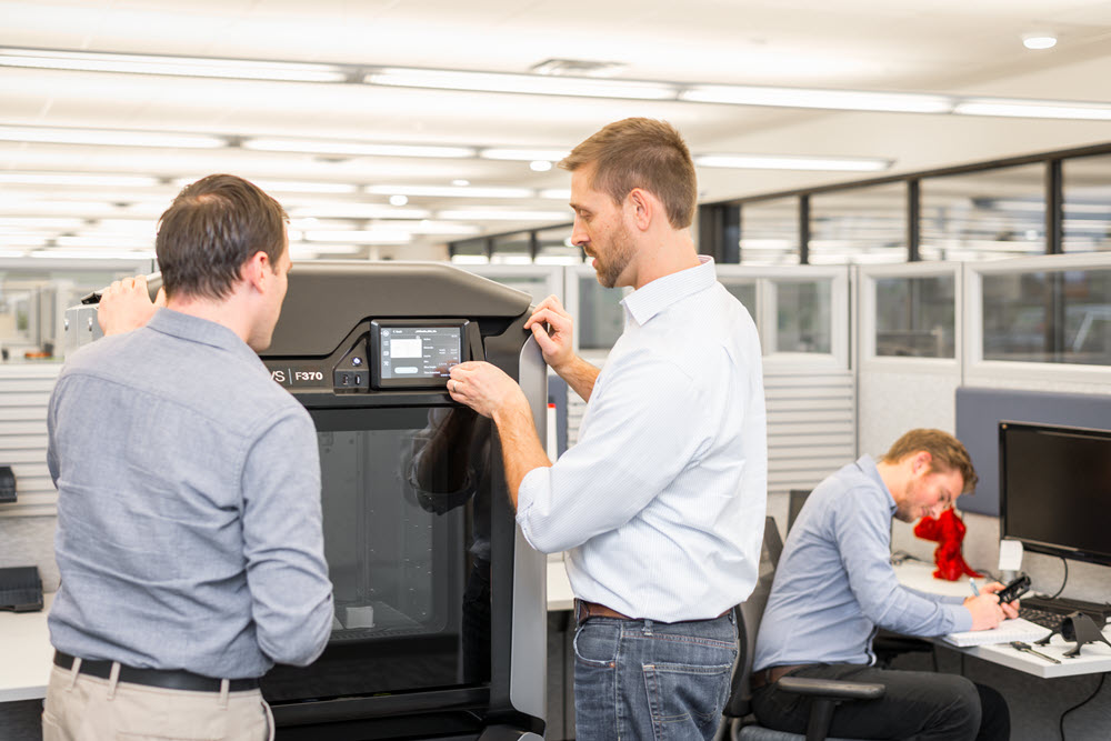 Engineers using a Stratasys F370 FDM 3D Printer
