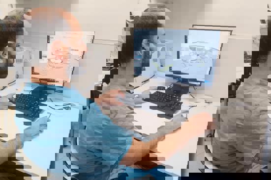 Suregon reviewing craniomaxillofacial 3D printed CAD