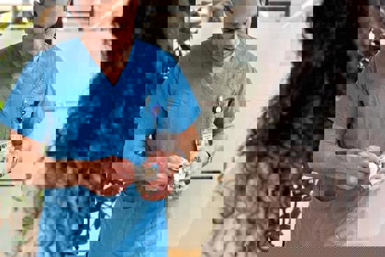 Surgeon and patient discussing point of care options