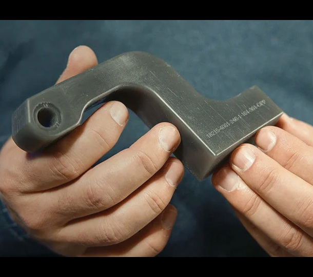 A main bracket Valiant TMS printed, shown with embossed 3D printing.