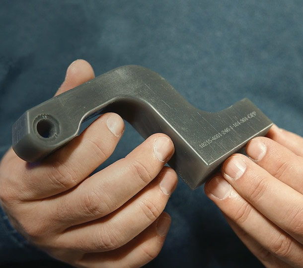A main bracket Valiant TMS printed, shown with embossed 3D printing.