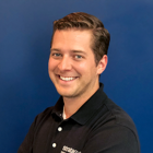 Portrait of Andrew Carter, Manager of Manufacturing Engineering at Stratasys Direct and expert in scaling high-performance additive manufacturing for regulated industries.