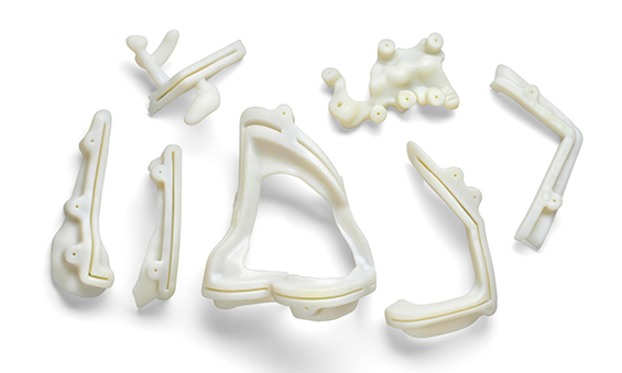 Collage of 3d printed biocompatible 3d printed medical parts
