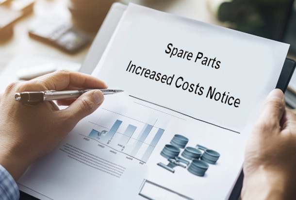 person holding paper with words spare parts cost increase notice