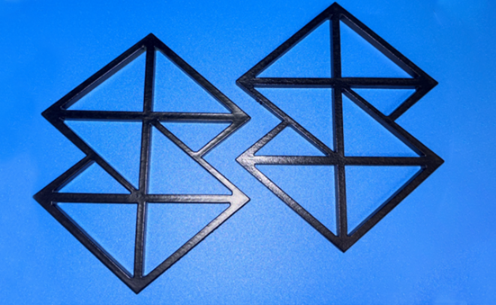 Stratasys Direct logos that were 3d printed and had vapor smoothing done for finishing