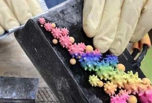 Tech working on PolyJet Ashley Alleyne purse