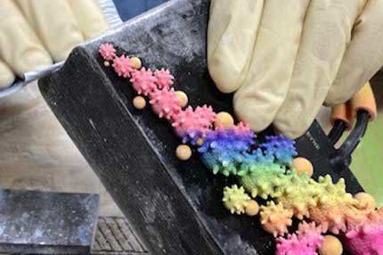 Tech working on PolyJet Ashley Alleyne purse