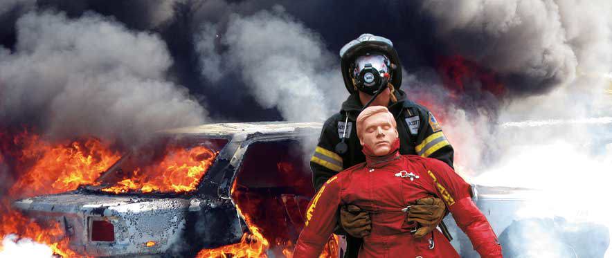 Firefighter with 3D Printed Rescue Randy training dummy