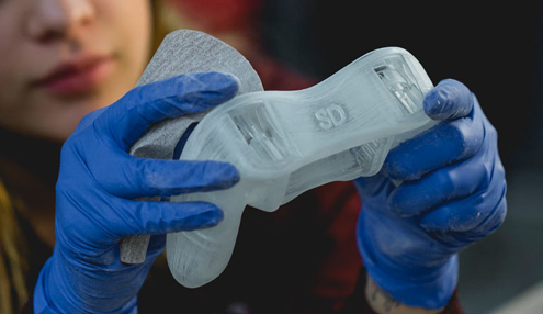 woman holding sla prototype game controller