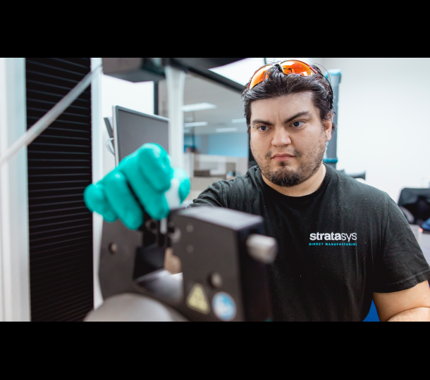 Man pulling FDM Services 3d printed tensile bar Stratasys Direct
