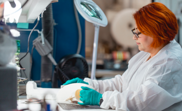 Woman finishing FDM 3d printed part Stratasys Direct