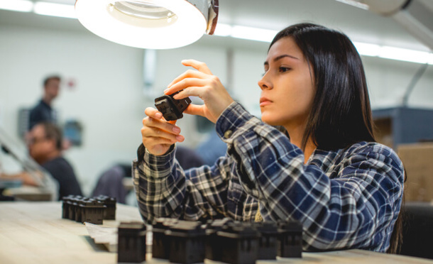Women visually inspecting SAF 3D printed parts Stratasys Direct